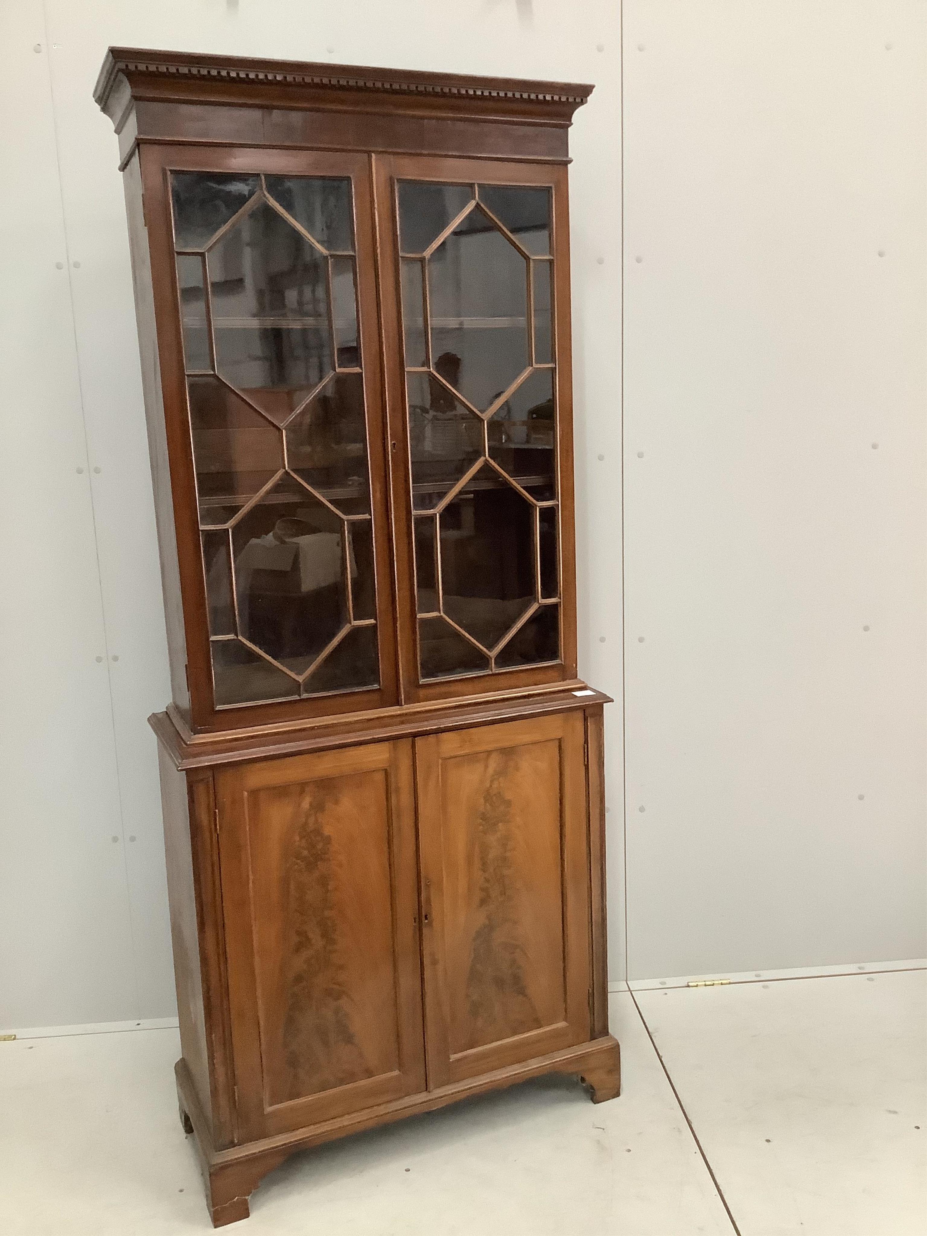 A George III style mahogany bookcase cupboard, width 86cm, 36cm, height 203cm. Condition - fair